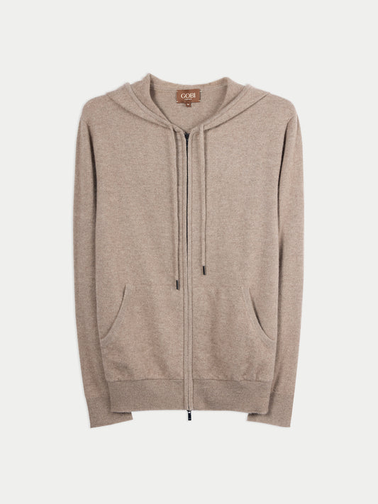 Vue de face d'un sweat à capuche beige à poches latérales sur fond gris clair. #color_beige