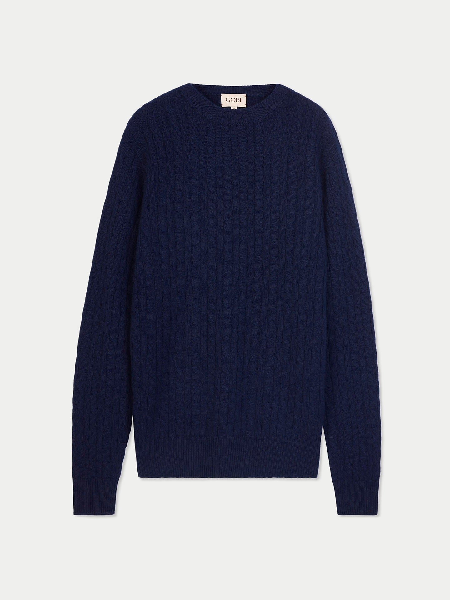 Vue de face d'un pull en cachemire à col rond bleu marine sur fond gris clair. #color_navy