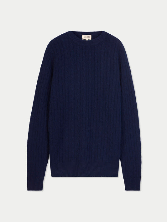 Vue de face d'un pull en cachemire à col rond bleu marine sur fond gris clair. #color_navy