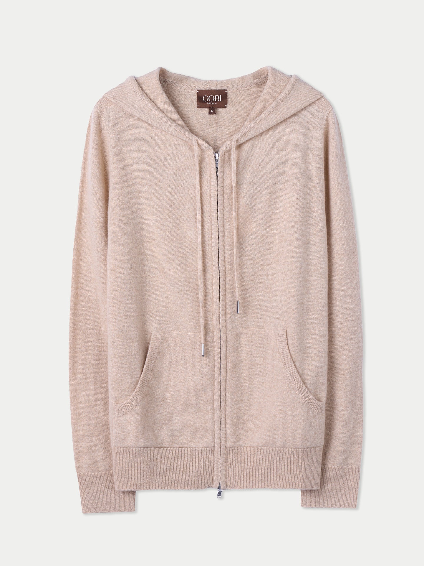 Vue de face d'un sweat à capuche beige à poches latérales sur fond gris clair. #color_beige